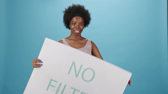 Portrait of Plus Size African American Woman on Blue Background