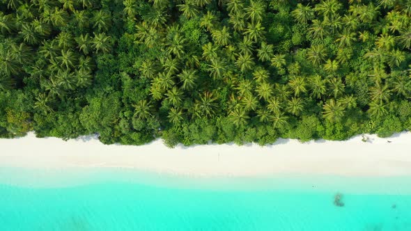 Beautiful overhead abstract view of a white sandy paradise beach and aqua turquoise water background