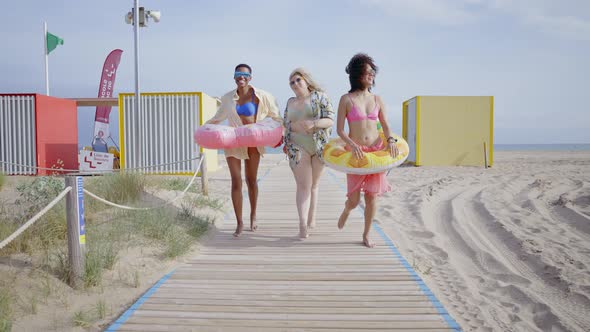 young women having fun on the beach