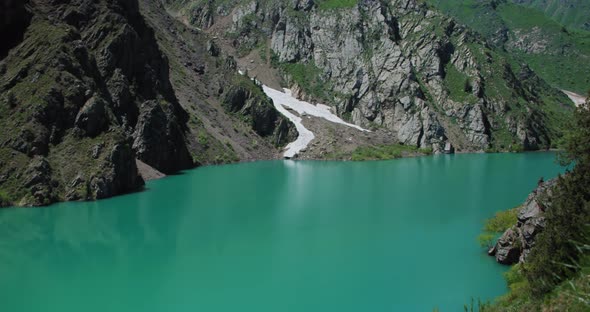 Mountain Lake of green and blue color Urungach. Located in Uzbekistan, Central Asia. 2 out of 10