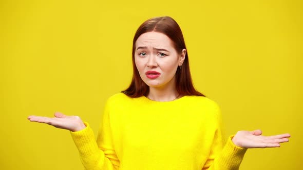 Annoyed Irritated Young Woman Gesturing in Slowmo and Looking at Camera at Yellow Background