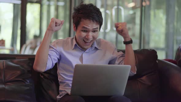 success man using laptop computer in a cafe