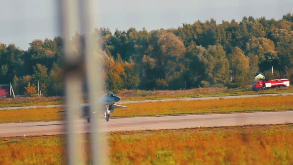 A Reactive Fighter Plane Taking Off the Runway