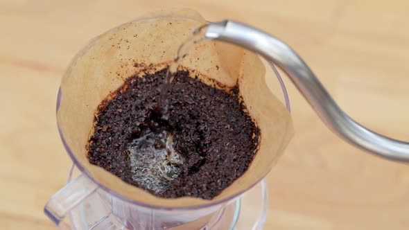 Pouring hot water into coffee filter with slow motion