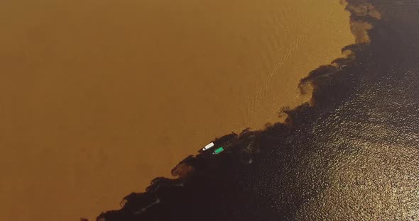 Top Down View Over the Boats Floating Along the Boundary of Water Confluence. Manaus. Brazil