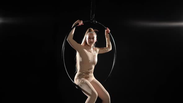 Tired Woman Sitting on Air Hoop Sighing Resting on Rehearsal