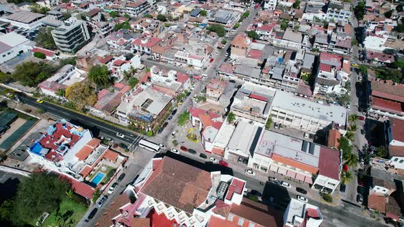 aerial top down of cars driving through the city in Puerto Vallarta on sunny day