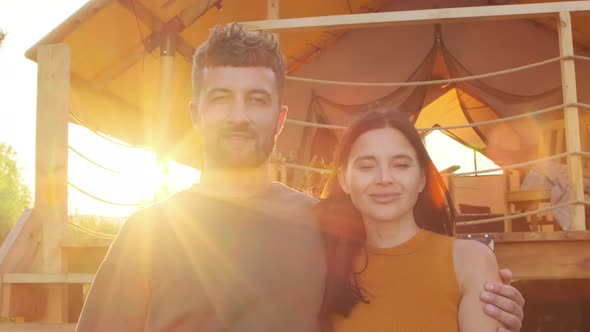 Spouses Posing by Glamping