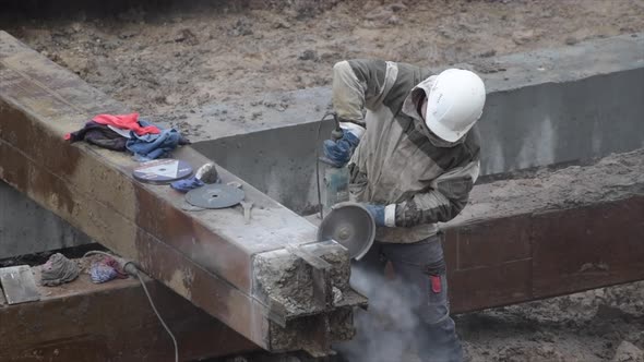 Angular Saw Grinding Through Construction Piles at Construction Site