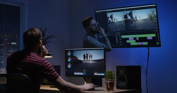 Young Man Editing Video Inside the Room