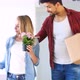 Young Couple Moving in New Home and Unpacking Carboard Boxes - VideoHive Item for Sale
