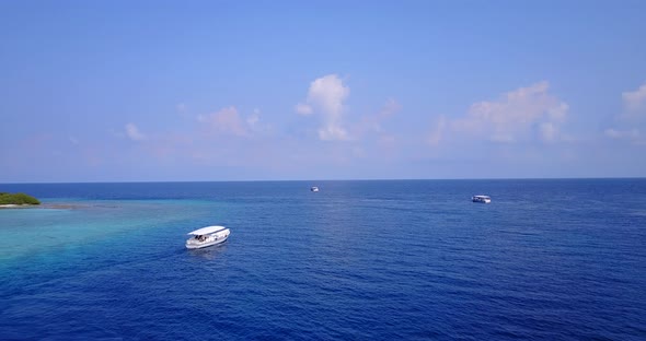 Beautiful flying island view of a paradise sunny white sand beach and blue water background in best 