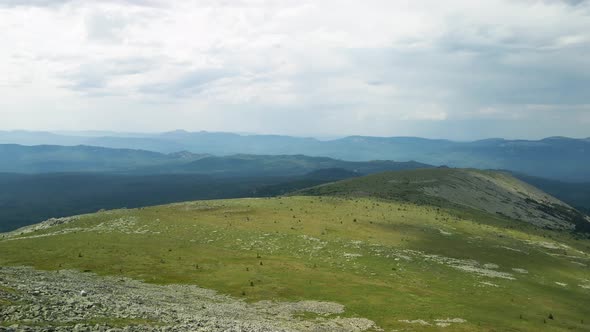 Panorama of green hill and mountains