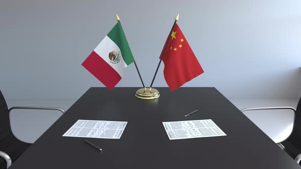 Flags of Mexico and China and Papers