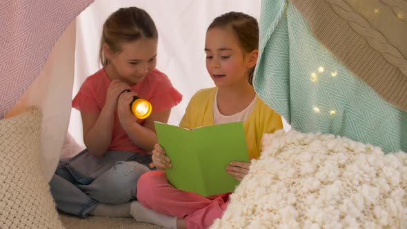 Happy Girls Reading Book in Kids Tent at Home