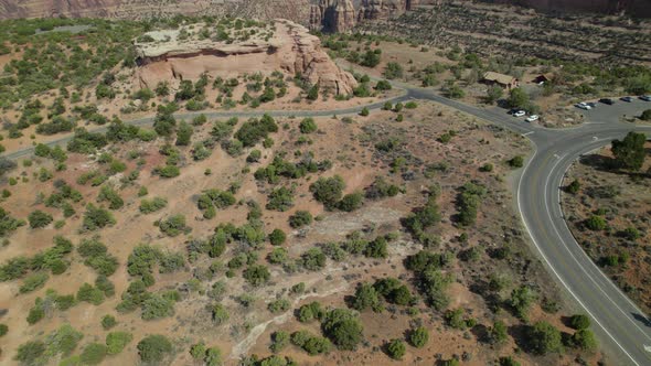 Drone tilts up to reveal canyon and red rocks in Colorado National Monument