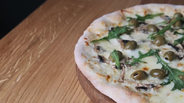 Appetizing Pizza on a Wooden Table in a Restaurant