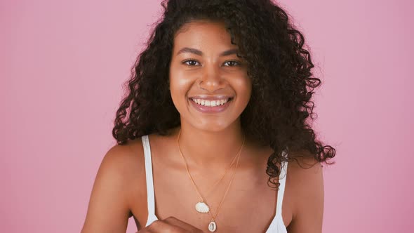 Young Ethnic Black Female in Jewelry and White Dress