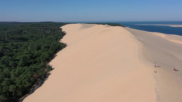 Overview of Dune du Pilat Sandhill in Arcachon Bassin France with People walking along the top ridge