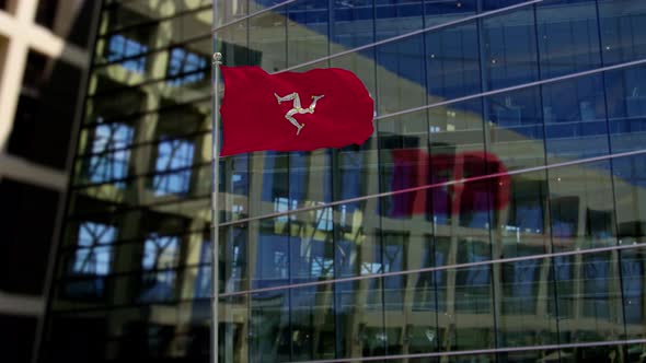 Isle of Man Flag Waving On A Skyscraper Building