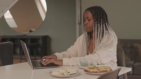 African American Female Freelancer Working from Home