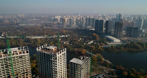 Landscape in the City with Under Construction Buildings and Industrial Cranes