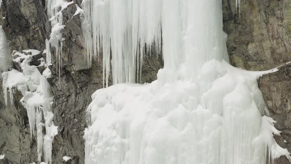 Mainline, Mount Kineo frozen ice cascade ascending cliff aerial 4K