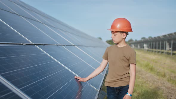 Portrait of a Child Near the Solar Panels