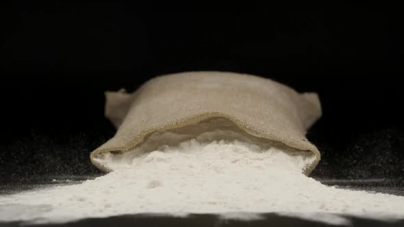 A Sac With Wheat Powder Falls On A Table