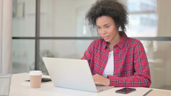 African Woman Talking on Video Call on Laptop