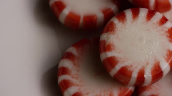 Rotating shot of peppermint candies - CANDY PEPPERMINT 054