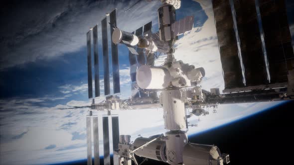 A View of the Earth and a Spaceship. ISS Is Orbiting the Earth