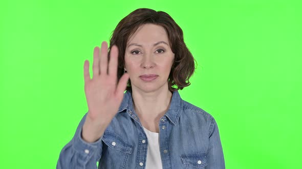 Stop Gesture By Old Woman on Green Chroma Key Background 