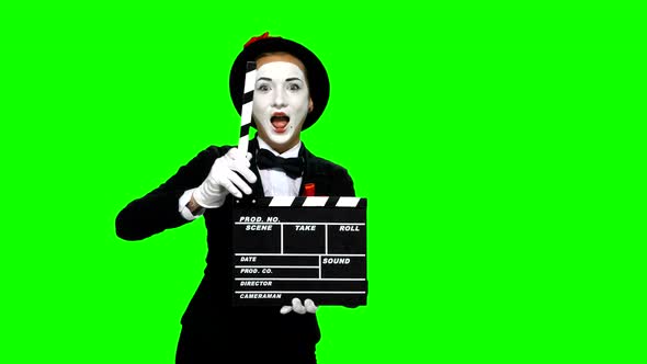Woman Mime Uses the Movie Clapper on Green Screen