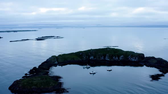 Fishing Boats In The Breidafjordur Bay Near Flatey Island In Iceland. aerial orbit