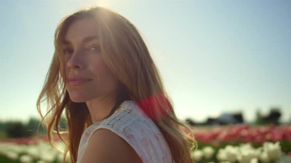 Romantic Woman Looking with Love in Flower Park