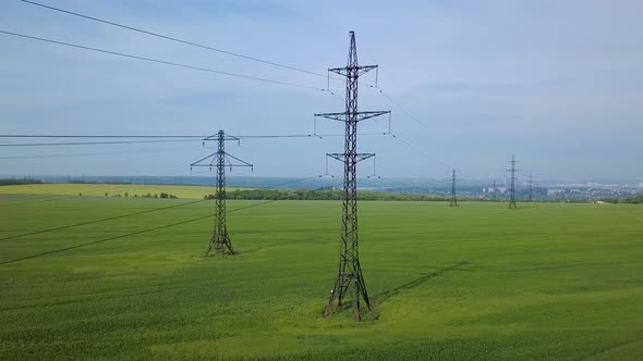 High-voltage Power Pylon on the Green Field