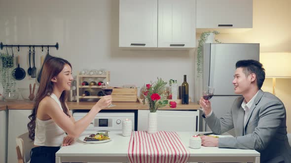 Asian young couple having dinner to celebrate valentine's day together.