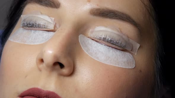 Face of a Young Girl in a Modern Eyelash Lamination Procedure in a Professional Beauty Salon