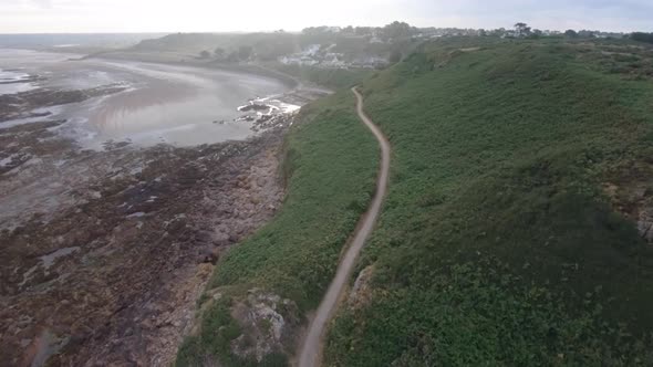 Drone aerial footage of the rocky cliffs of Beauport Beach in Jersey.