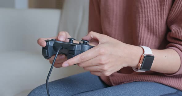 Woman play tv game at home