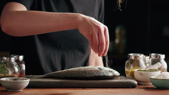 Woman Cooking Fish Closeup