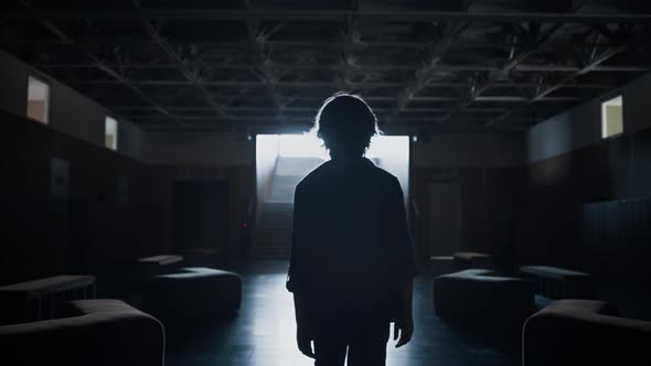 Schoolboy Silhouette Walking Dark Corridor Alone