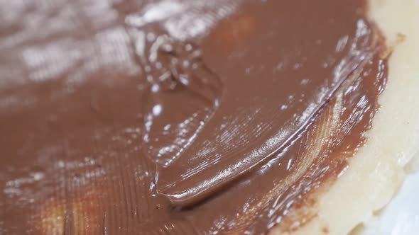 Chocolate  topping of tasty sweet ready to be  rolled slow-mo 1920X1080 HD tilting footage - Slow mo