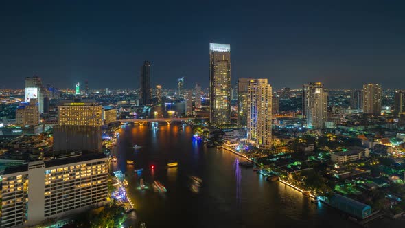 Time lapse of aerial view of boats and Taksin Bridge with Chao Phraya River, Bangkok