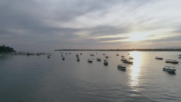 Aerial view at group of traditional boats anchored next Gili Trawangan island.