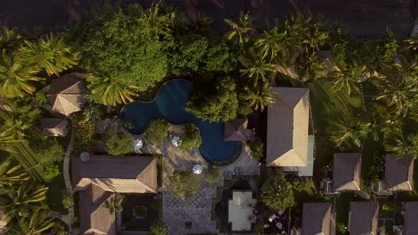 Aerial view above of traditional bungalow resort, Bali island, Indonesia.