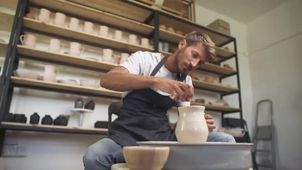 Handicraft the Man Potter Makes a Pitcher Out of Clay Handicraft Production of Handmade Tableware