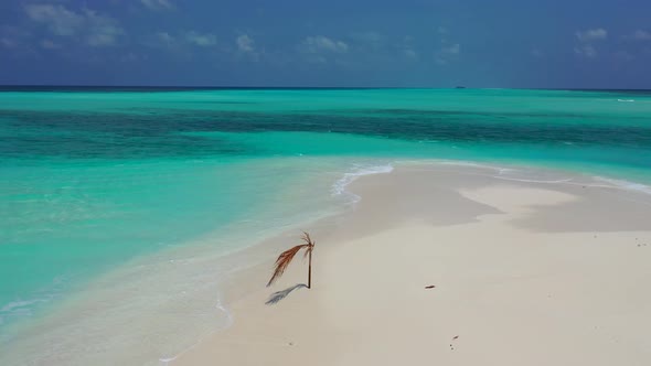 Wide angle aerial copy space shot of a white paradise beach and blue sea background in best quality 