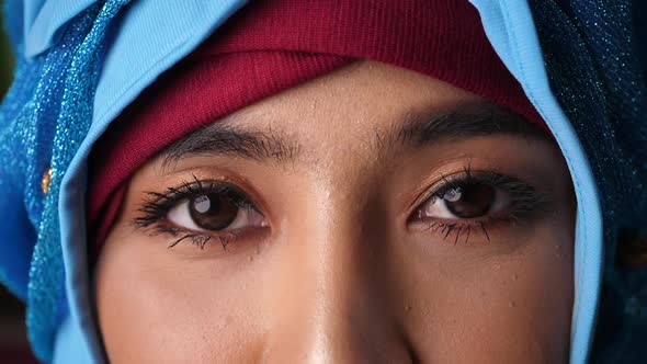 The eyes of a Muslim woman looking at the camera.